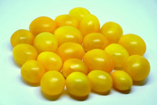 Close up of a pile of yellow cherry tomatoes — 스톡 사진