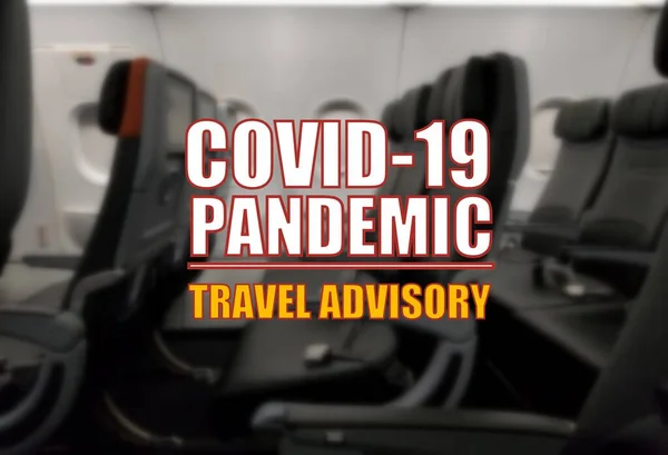 Covid-19 pandemic travel advisory on a blurry background