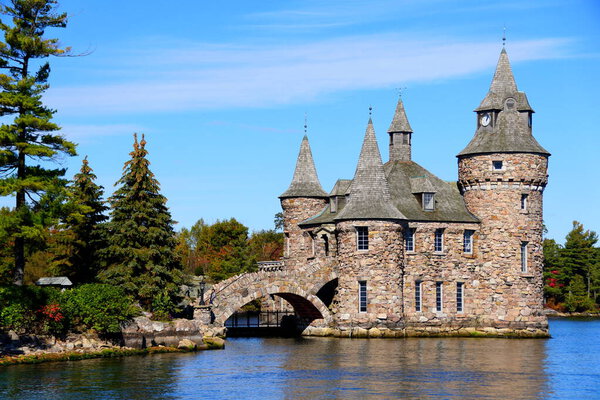 Alexandria Bay, New York, U.S.A - October 24, 2019 - The view of The Power House and Clock Tower of Boldt Castle on St Lawrence River