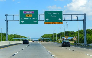 Dover, Delaware, U.S.A - May 23, 2020 - Traffic on Route 1 near the EZpass toll entrance clipart