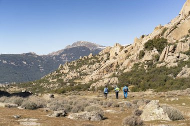 Panoramic view of granite rocks in La Pedriza, National Park of mountain range of Guadarrama in Manzanares El Real, Madrid, Spain. clipart