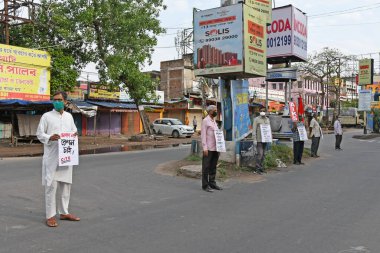 Protest rallies by several leftist organizations demanding that the government play a proper role in preventing the Novel Coronavirus (COVID-19). At Burdwan Town, Purba Bardhaman District, West Bengal, India. clipart