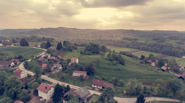 Aerial view of countryside at sunset. Rural area from above.