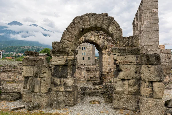 Ancient ruins of old roman amphiteatre built in Aosta. — Stock Photo, Image