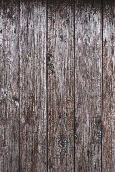 Hölzerne Hintergrundstruktur mit Knoten im Holz. senkrechte Planken, Stangen — Stockfoto