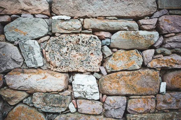 Rustic wall made of stones. Background, texture, pattern