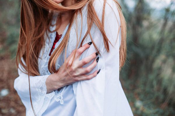 Close-up photo of woman hand with long black nails. Gothic emo style