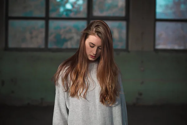 Portrait of cute, redhead teenage girl in gray sweater. Human emotions — Stock Photo, Image