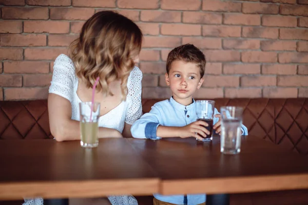 Cute Boy Drinking Soda Soft Drink Cafe His Mom Next — Stock Photo, Image