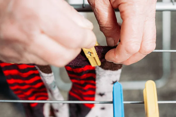 Female Hand Hanging Freshly Washed Socks Wire — Stock Photo, Image