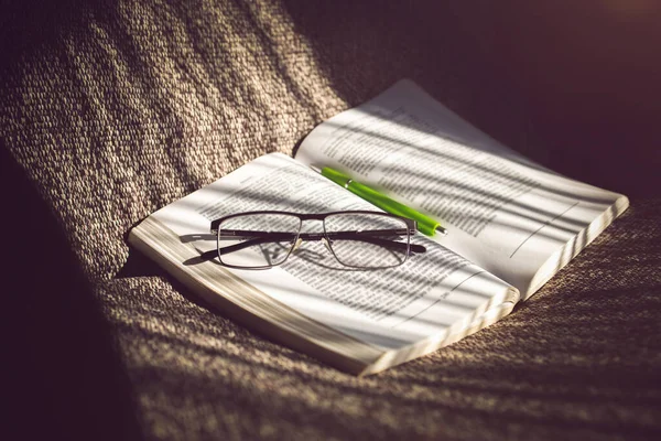 Open Book Eyeglasses Pen Sofa Reading Afternoon Relax Time — Stock Photo, Image