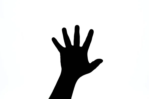 Black hand on a white background signifying a stop. — Stock Photo, Image