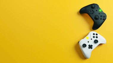 Oyun yarışması. Sarı arka plan gerçekçiliğine sahip beyaz ve siyah joystick