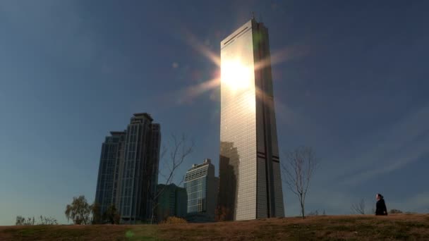 View Passserby Buildings Glare — стоковое видео
