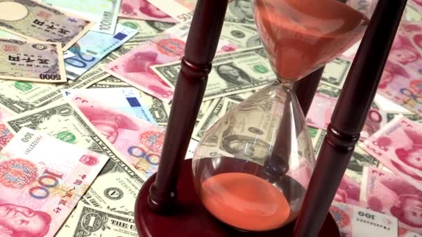 Orange Sand Flowing Hourglass Currency Background — Stock Video
