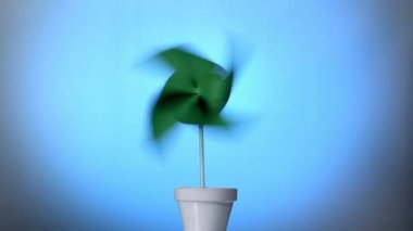 Pot ve çalışma yeşil fırıldak ile enerji kavram