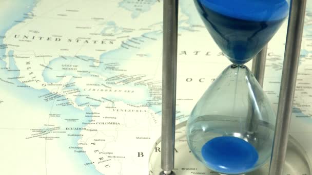 Blue Sand Flowing Hourglass World Map Background — Stock Video