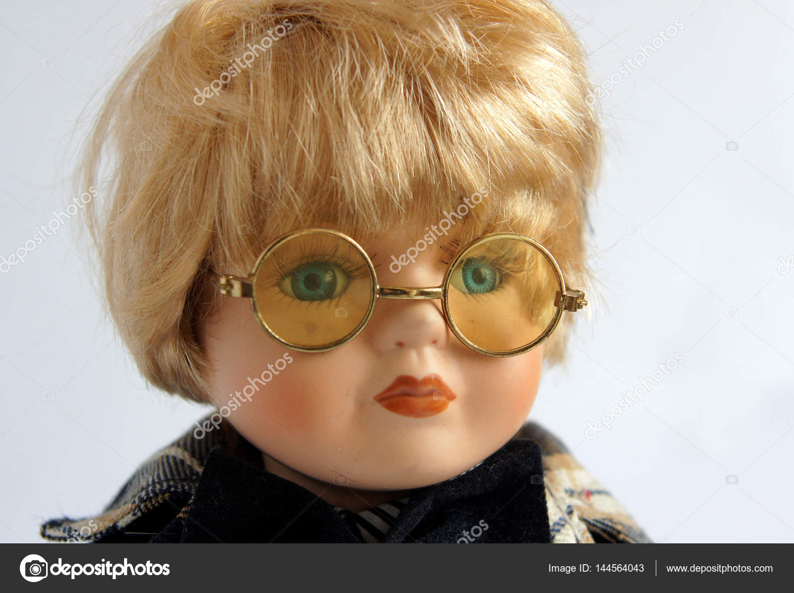 boy doll with glasses