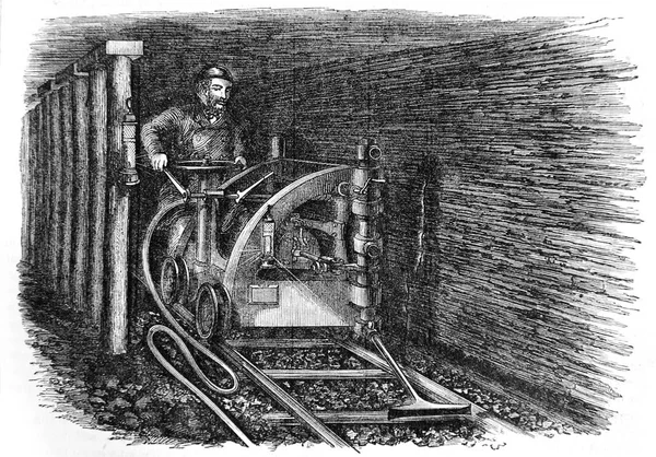 The miner mines coal deep underground — Stock Photo, Image