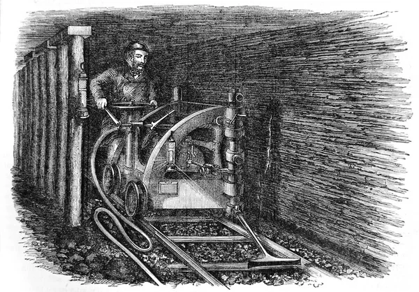 Horník doly uhelné hluboko pod zemí — Stock fotografie