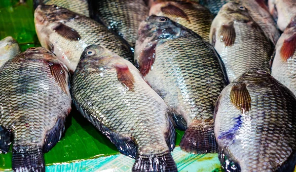 Fish on banana leaf at the local market in Asia.