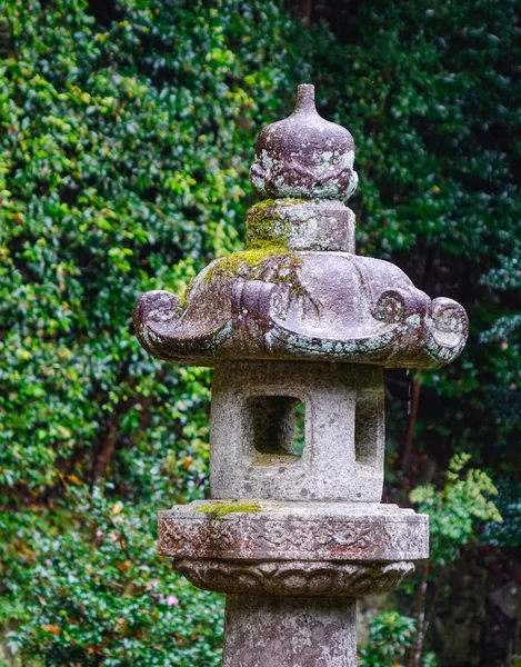 Stone lantern in Japanese garden in Kyoto, Japan.