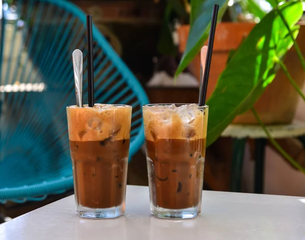 Glass cup of iced milk coffee — Stock Photo, Image