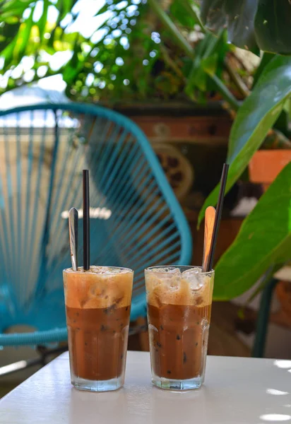 Glass cup of iced milk coffee — Stock Photo, Image