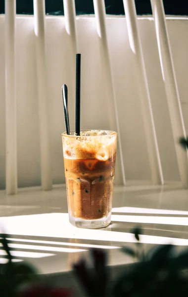 Glass cup of iced milk coffee — Stock Photo, Image