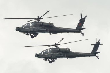 Singapore - Feb 12, 2020. US Air Force Boeing AH-64 Apache attack helicopter flying for display in Changi Air Base, Singapore. clipart