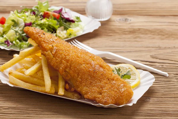 Fried fish and chips on a paper tray — Stock Photo, Image