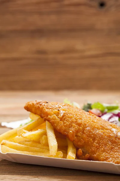 Fried fish and chips on a paper tray — Stock Photo, Image