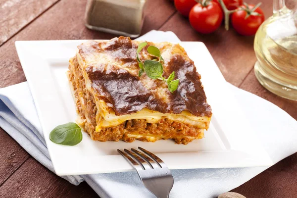 Portion of tasty lasagna on a plate — Stock Photo, Image