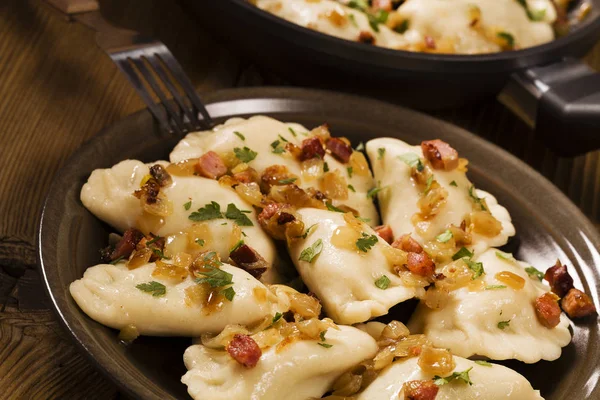 Delicious homemade dumplings with onion and bacon — Stock Photo, Image