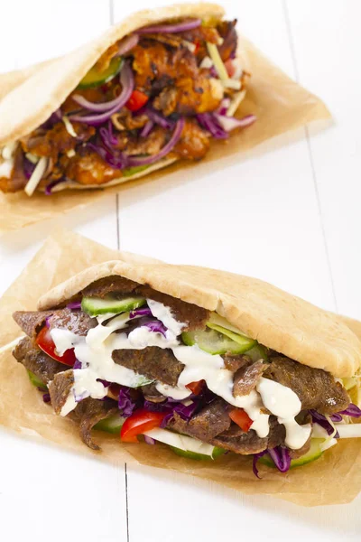 Kebab in a bun with sauce — Stock Photo, Image