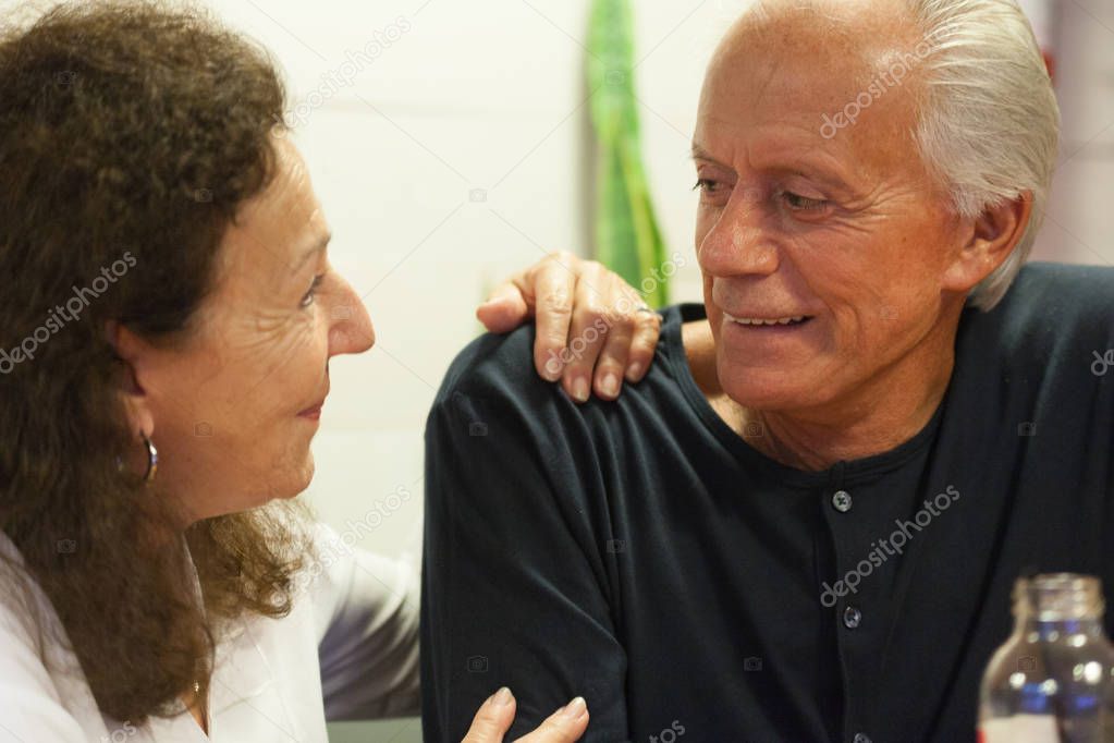 elderly couple  in a bar