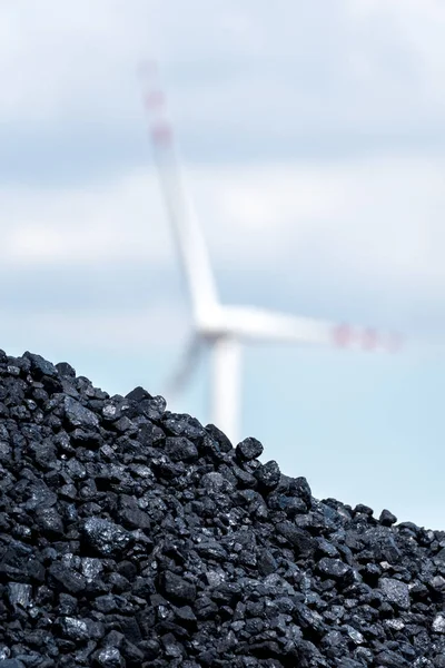 Pile of carbon and the windmill — Stock Photo, Image