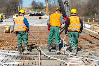 Concrete pouring on the construction site clipart