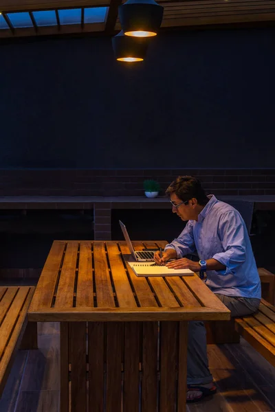 Man working alone at night — Stock Photo, Image
