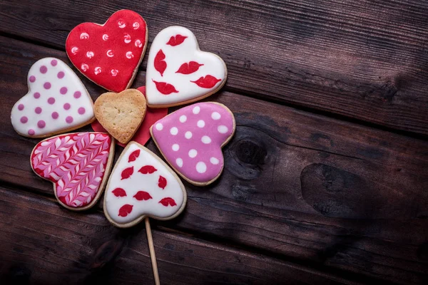 Heart shaped cakes on wooden background — Stock Photo, Image