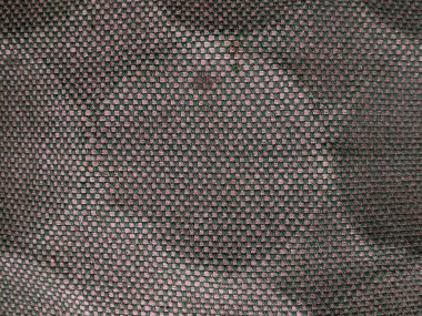 Yeşil ve kahverengi benekli, eski, kirli bir kumaş. Yüzeyde halka formunda izler beliriyor. Soyut arkaplan. Düz yatıyordu. Boşluğu kopyala.