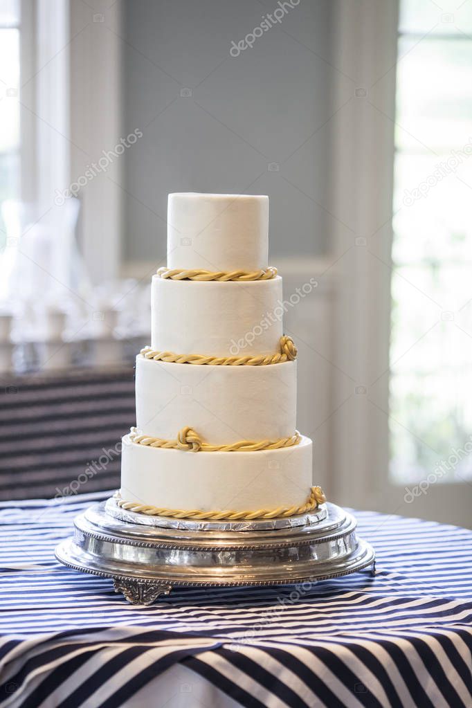 Plain four tiered wedding cake, place your own topper.