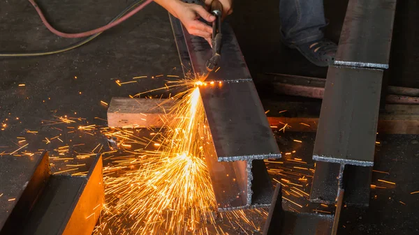 Metal cutter, steel cutting with acetylene torch.