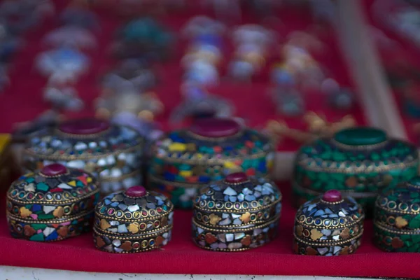 Metal caskets with multi-colored pebbles — ストック写真