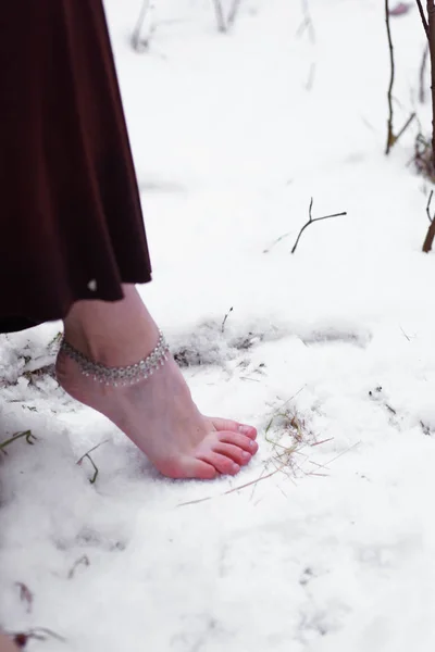 Female leg on a log and tambourine — 스톡 사진