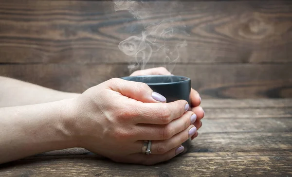 Black Cup Coffee Tea Hands Woman Wooden Background Steam Rises — ストック写真