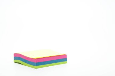 Notebook with colorful leaflets. Pile of stickers. On white background