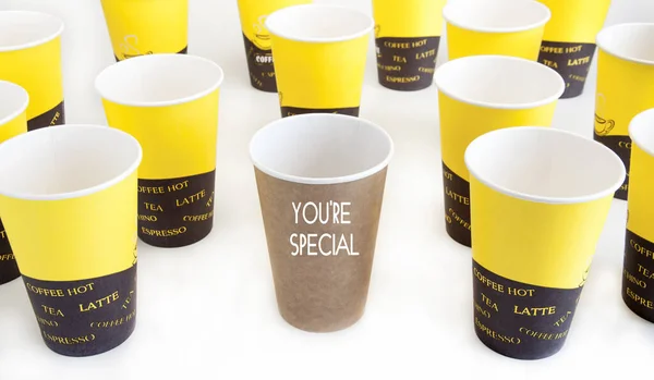 Motivational illustration. Disposable glasses. Lettering You are Special