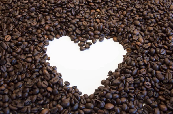 Whole bean coffee. Heart in the coffee. The love of coffee.