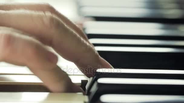 Girl playing on piano close-up 4K — Stock Video